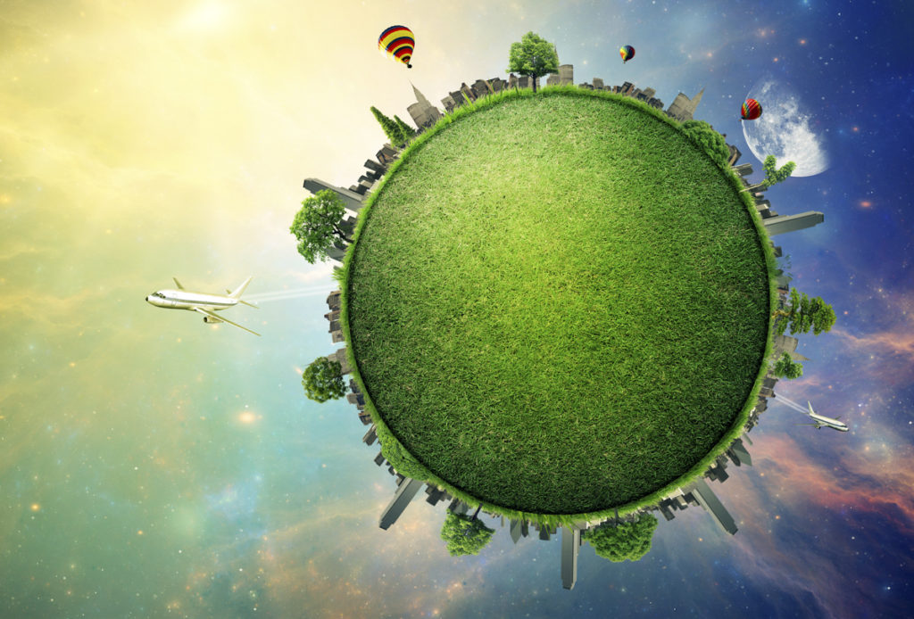 Grafik zu nachhaltig Reisen - grüne Erde aus Gras mit Skyline