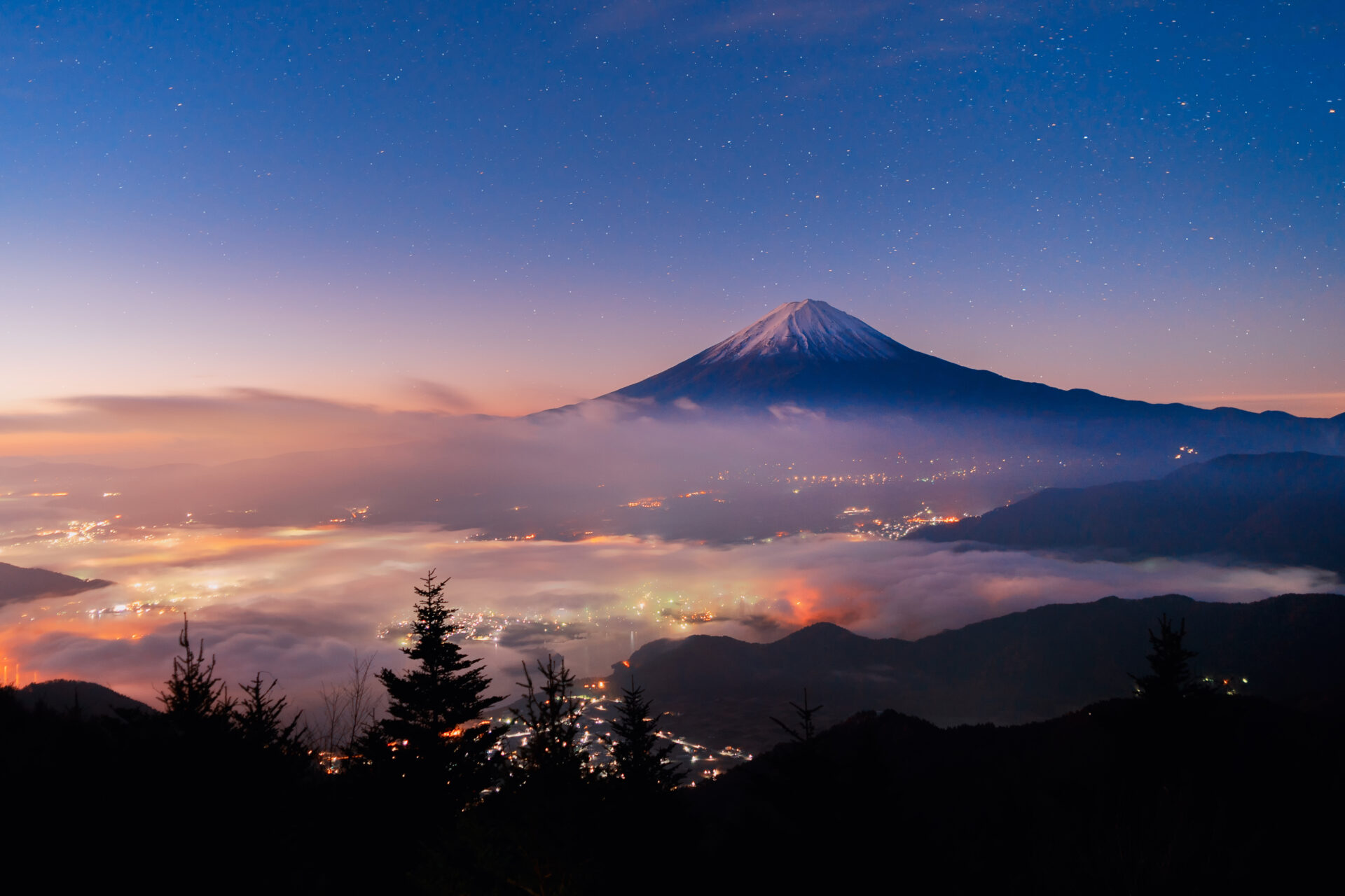 Aerial view of Fuji mountain with mist or fog at sunrise in Fujikawaguchiko, Yamanashi. Fuji five lakes, Japan. Landscape with hills